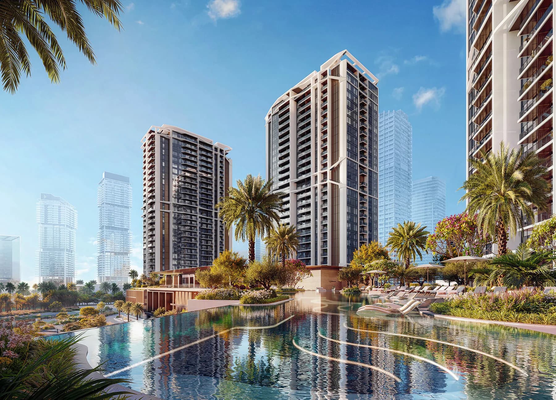 Eltiera Views residential towers beside a landscaped lake and infinity pool