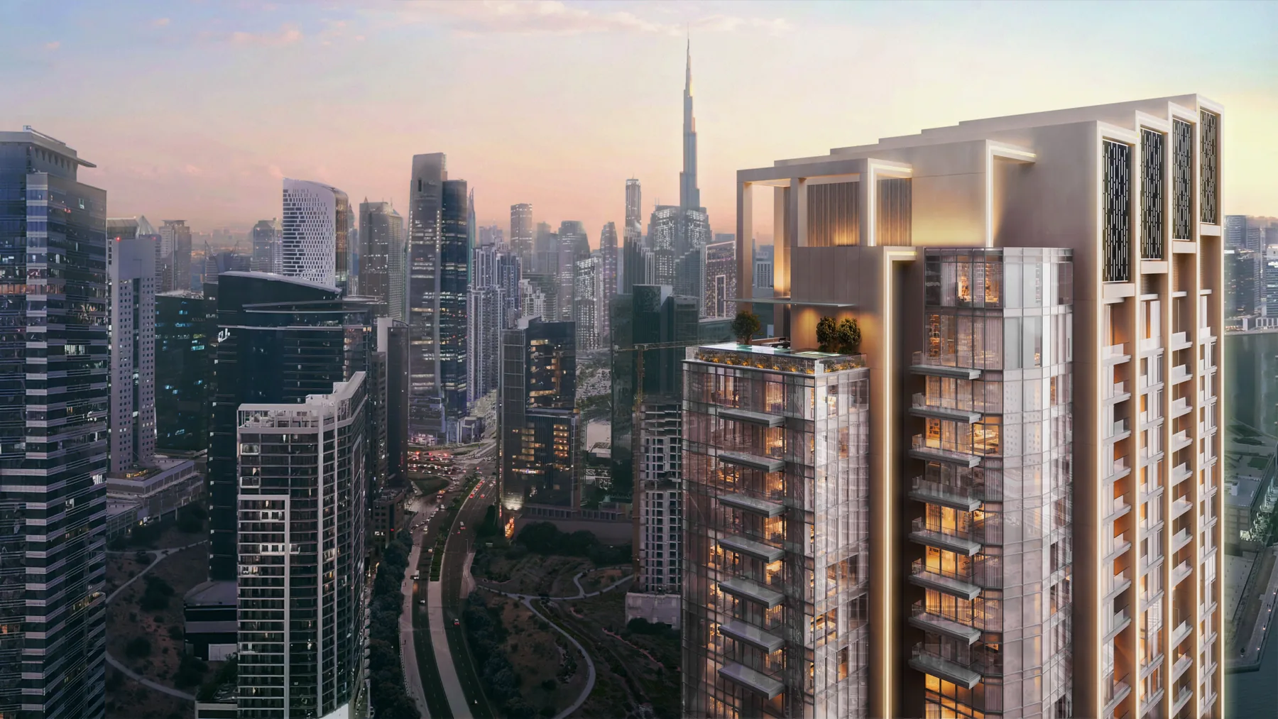 One River Point tower facade with the Burj Khalifa skyline in the distance